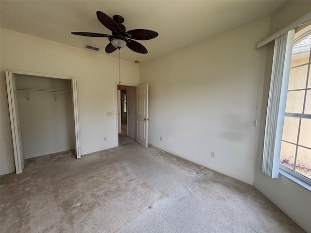 2846 N Kittery Pt, Hernando, FL 34442 - unfurnished bedroom featuring multiple windows, carpet floors, a closet, and a ceiling fan