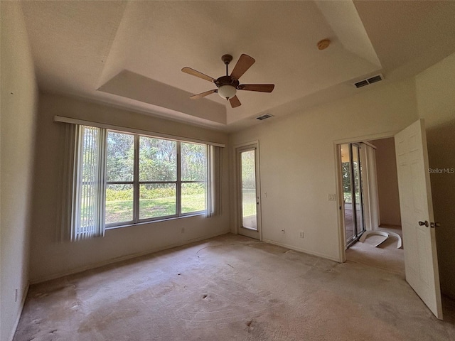 2846 N Kittery Pt, Hernando, FL 34442 - spare room featuring a raised ceiling, a ceiling fan, carpet flooring, and baseboards