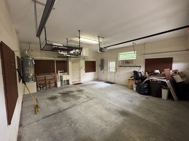 2846 N Kittery Pt, Hernando, FL 34442 - garage featuring water heater, a garage door opener, electric panel, and cooling unit