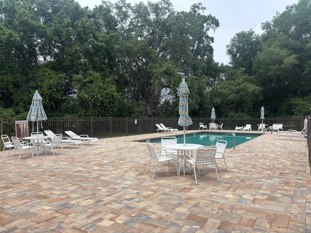 2846 N Kittery Pt, Hernando, FL 34442 - community pool featuring a patio and view of scattered trees