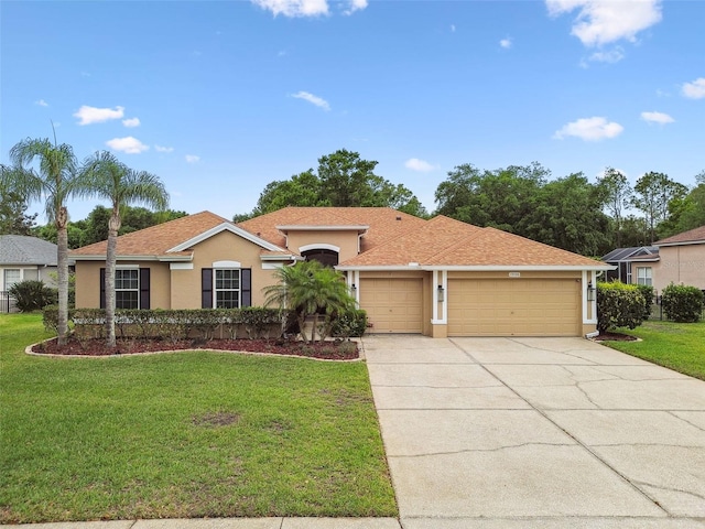 19106 Beckett Dr, Odessa, FL 33556 - view of front facade with an attached garage, stucco siding, concrete driveway, a front lawn, and a shingled roof