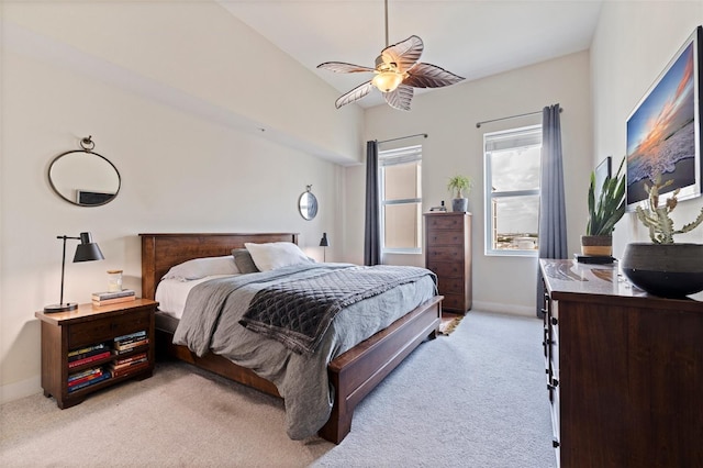 1208 E Kennedy Blvd Unit 831, Tampa, FL 33602 - bedroom with light carpet, baseboards, and ceiling fan