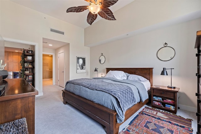 1208 E Kennedy Blvd Unit 831, Tampa, FL 33602 - bedroom with carpet flooring, ensuite bath, a closet, baseboards, and a towering ceiling