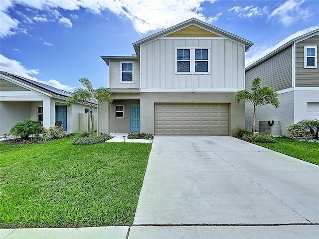 7554 Wallflower Trl, Wesley Chapel, FL 33545 - view of front of property with board and batten siding, a front yard, driveway, and an attached garage
