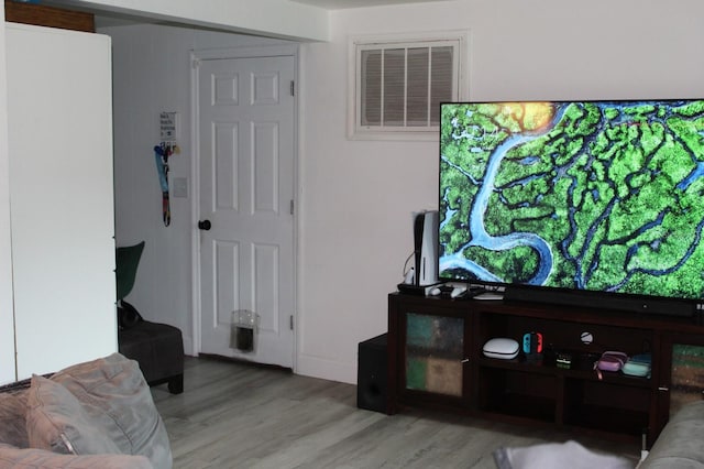 4928 Lake Ridge Ln, Holiday, FL 34690 - living room with wood finished floors