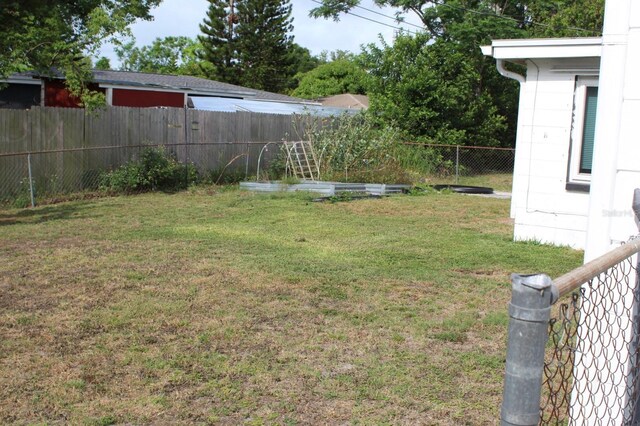 4928 Lake Ridge Ln, Holiday, FL 34690 - view of yard with a garden