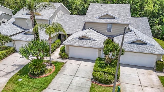 1628 Lullwater Ln, Lutz, FL 33549 - traditional-style house with a shingled roof and driveway