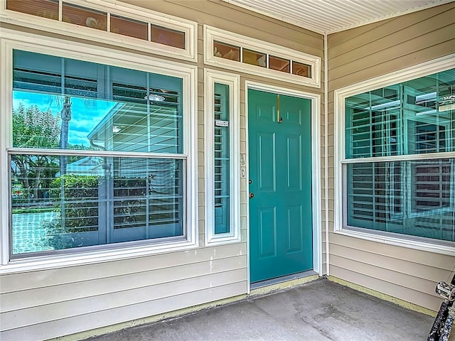 1628 Lullwater Ln, Lutz, FL 33549 - doorway to property featuring a porch
