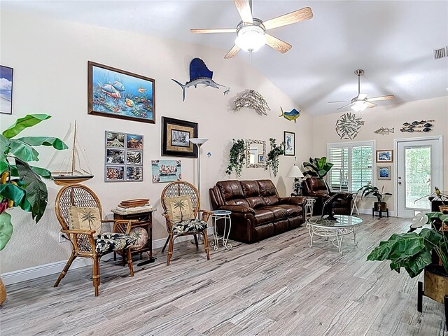 1628 Lullwater Ln, Lutz, FL 33549 - living room with a ceiling fan, light wood finished floors, baseboards, and high vaulted ceiling
