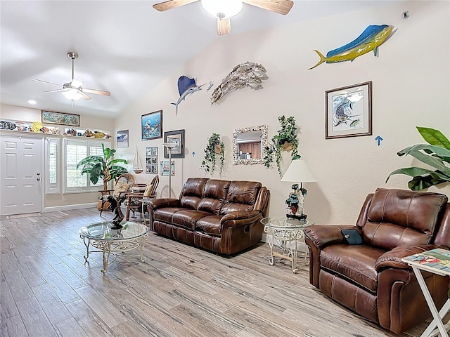 1628 Lullwater Ln, Lutz, FL 33549 - living room featuring ceiling fan, wood finished floors, lofted ceiling, and baseboards