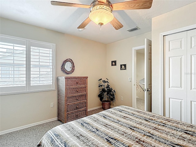 1628 Lullwater Ln, Lutz, FL 33549 - bedroom with carpet, baseboards, a closet, and ceiling fan