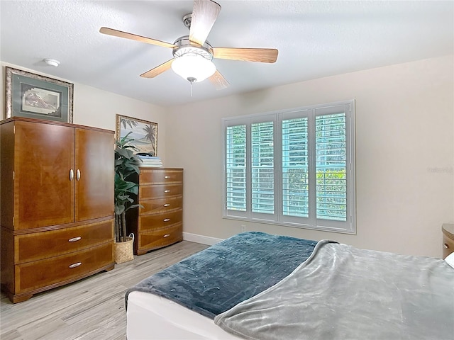 1628 Lullwater Ln, Lutz, FL 33549 - bedroom featuring light wood-type flooring, baseboards, and ceiling fan