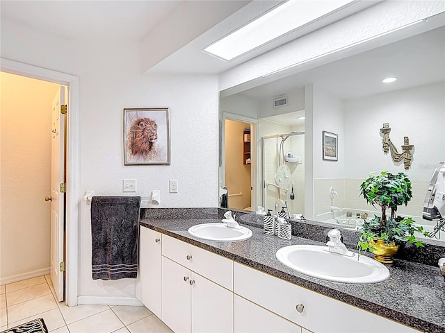 1628 Lullwater Ln, Lutz, FL 33549 - full bathroom featuring a stall shower, tile patterned flooring, and double vanity