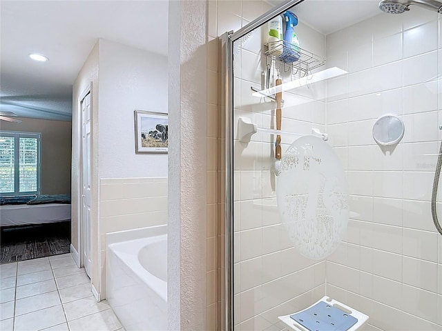 1628 Lullwater Ln, Lutz, FL 33549 - ensuite bathroom with a shower stall, tile patterned flooring, a garden tub, recessed lighting, and a chandelier