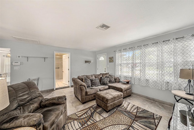 living area with light tile patterned floors
