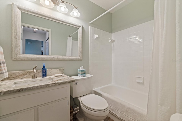 bathroom with toilet, shower / tub combo, and vanity
