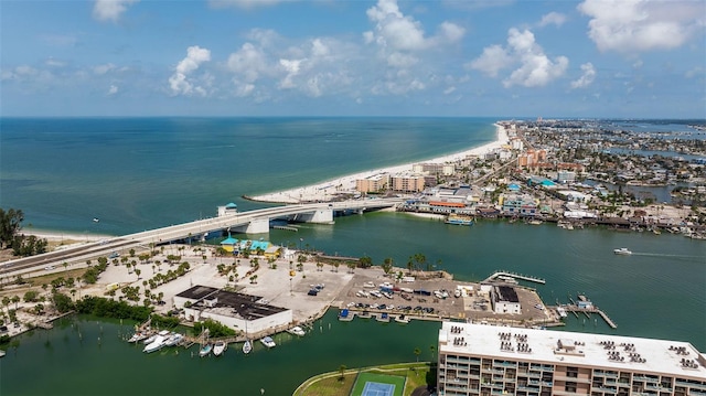 drone / aerial view of a nearby body of water and a notable bridge