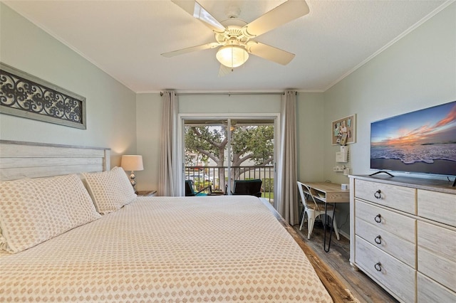 bedroom with access to exterior, dark wood-style flooring, ornamental molding, and a ceiling fan