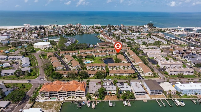aerial view of property's location with a large body of water