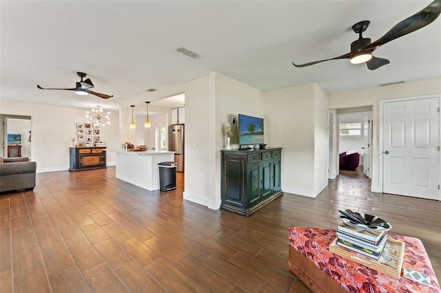 4600 Chancellor St NE, Saint Petersburg, FL 33703 - living area with ceiling fan, baseboards, and dark wood-style floors
