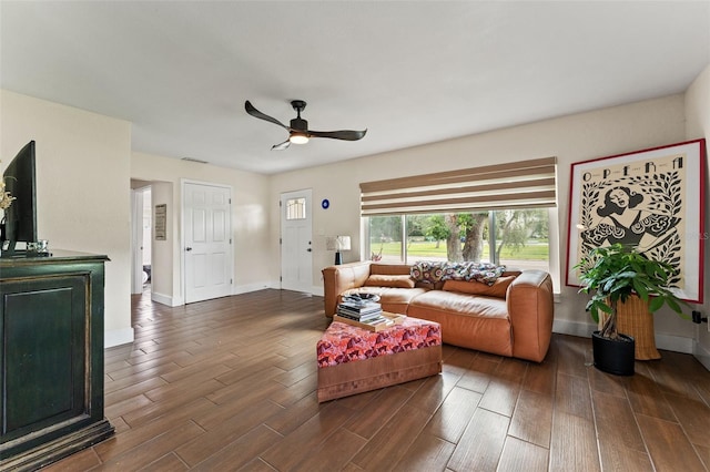 4600 Chancellor St NE, Saint Petersburg, FL 33703 - living area featuring dark wood-style floors, baseboards, and a ceiling fan