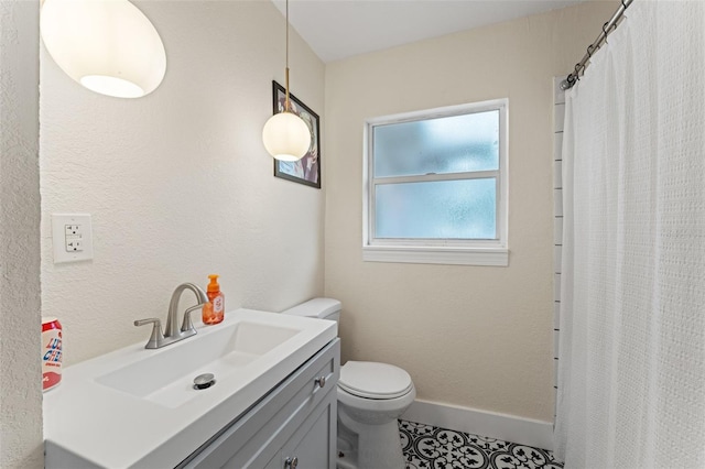 4600 Chancellor St NE, Saint Petersburg, FL 33703 - full bath with toilet, vanity, tile patterned flooring, and a shower with curtain