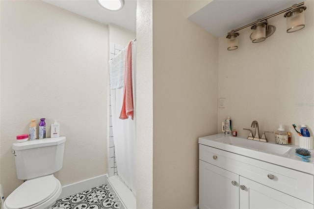 4600 Chancellor St NE, Saint Petersburg, FL 33703 - bathroom with toilet, vanity, a shower with curtain, baseboards, and tile patterned flooring