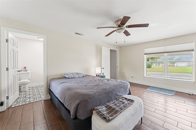 4600 Chancellor St NE, Saint Petersburg, FL 33703 - bedroom with wood finished floors, baseboards, ceiling fan, and ensuite bath