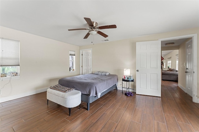 4600 Chancellor St NE, Saint Petersburg, FL 33703 - bedroom with multiple windows, baseboards, dark wood finished floors, and ceiling fan
