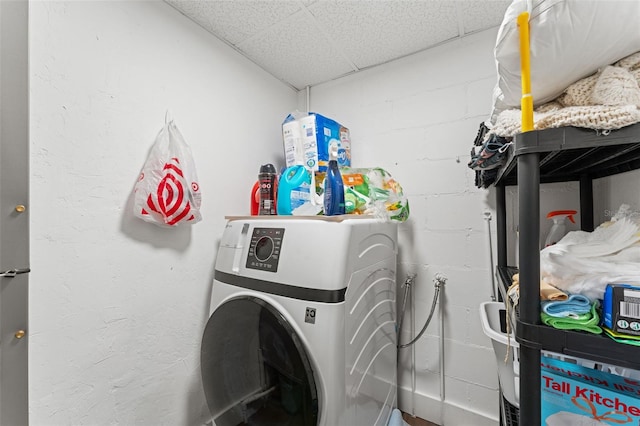 4600 Chancellor St NE, Saint Petersburg, FL 33703 - laundry room featuring washer / dryer and concrete block wall