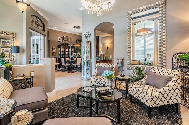 tiled living area featuring arched walkways, a chandelier, and ornamental molding