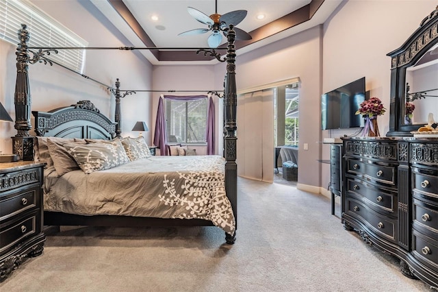 bedroom with light colored carpet, baseboards, access to exterior, a towering ceiling, and recessed lighting
