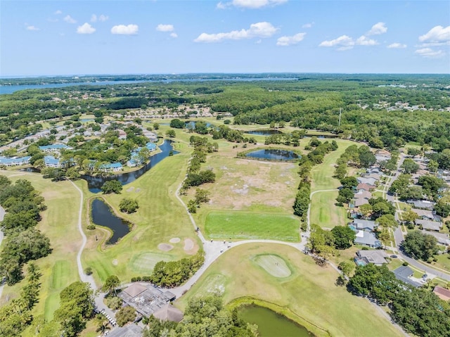 aerial overview of property's location featuring a large body of water, a local golf course, and nearby suburban area