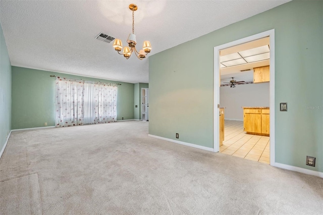 3230 Player Dr, New Port Richey, FL 34655 - spare room with carpet, a chandelier, baseboards, and a textured ceiling