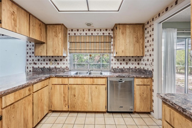 3230 Player Dr, New Port Richey, FL 34655 - kitchen featuring dishwasher, a sink, light tile patterned floors, and dark countertops