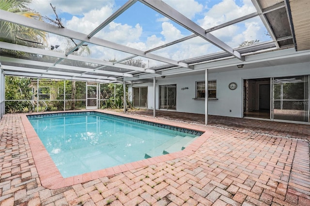 3230 Player Dr, New Port Richey, FL 34655 - swimming pool featuring a patio area and glass enclosure
