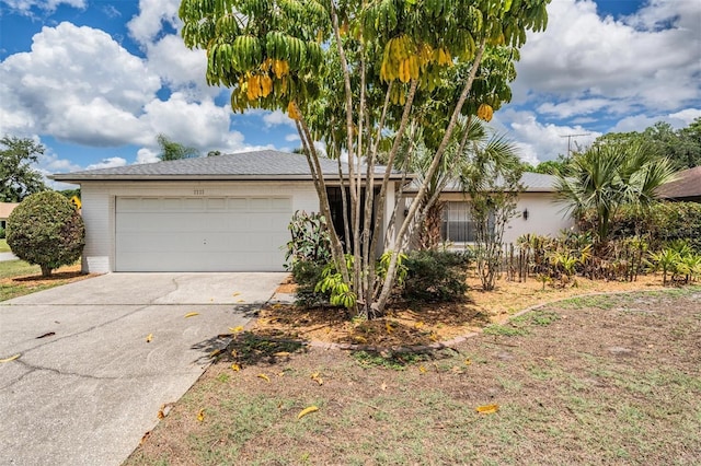 3230 Player Dr, New Port Richey, FL 34655 - ranch-style home with driveway and a garage