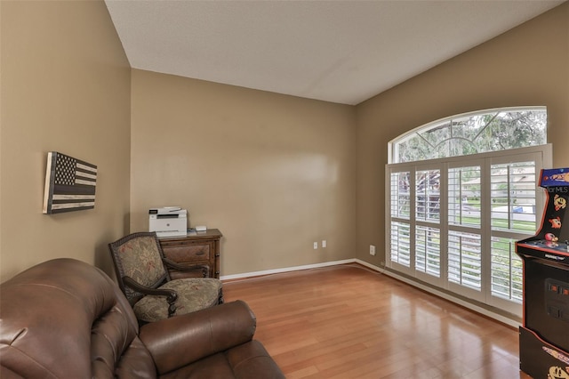 sitting room featuring wood finished floors and baseboards
