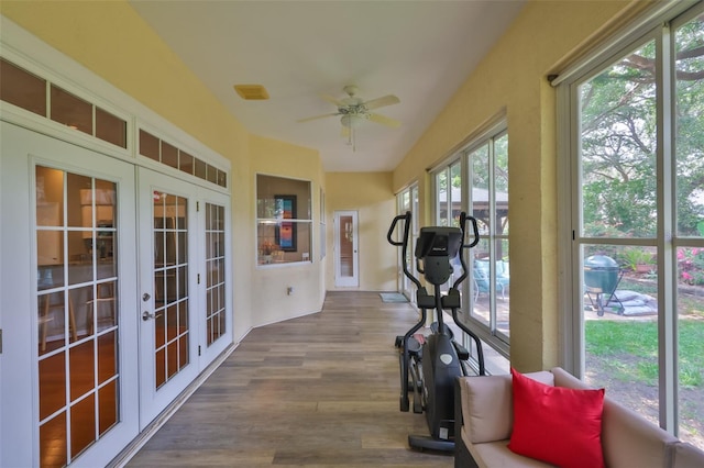 sunroom / solarium with french doors and wood finished floors