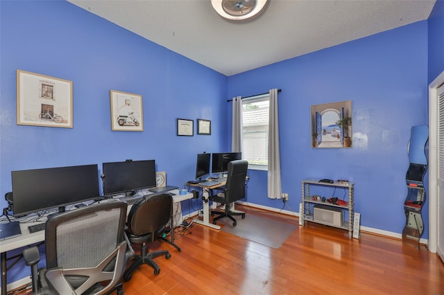 office featuring wood finished floors and baseboards