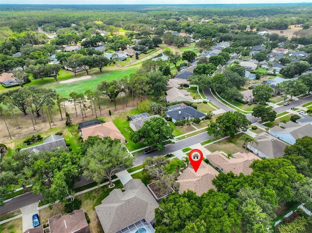 aerial view of property and surrounding area featuring nearby suburban area