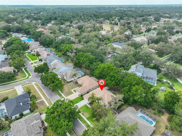 aerial view of property and surrounding area with nearby suburban area