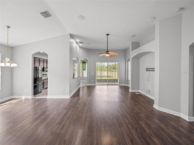 12713 Whitney Meadow Way, Riverview, FL 33578 - unfurnished living room with a ceiling fan, dark wood-style floors, arched walkways, and baseboards