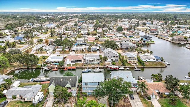 aerial perspective of suburban area with a large body of water
