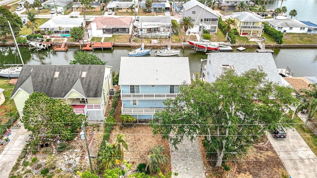 aerial view of residential area with a nearby body of water