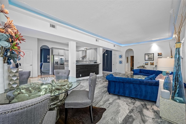 19620 Eagle Crest Dr, Lutz, FL 33549 - living area with arched walkways and light marble finish flooring