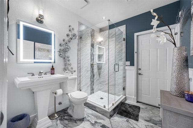 19620 Eagle Crest Dr, Lutz, FL 33549 - full bathroom with marble look tiles, a stall shower, and toilet