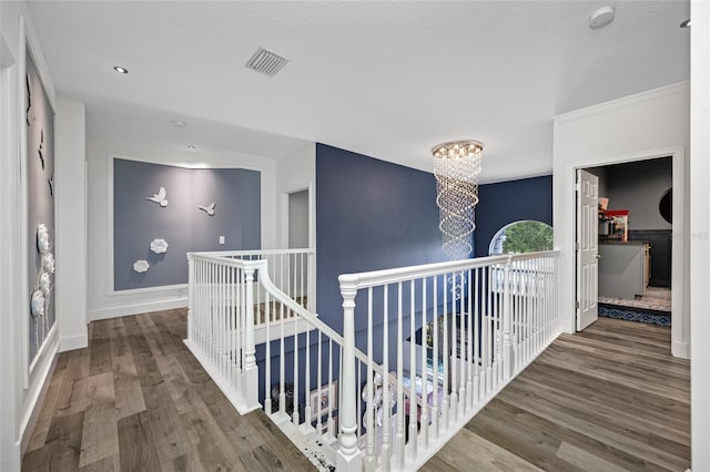 19620 Eagle Crest Dr, Lutz, FL 33549 - hall featuring an upstairs landing, a chandelier, wood finished floors, and baseboards