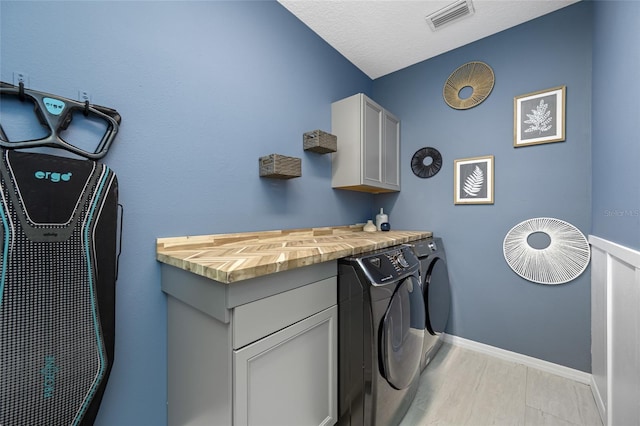 19620 Eagle Crest Dr, Lutz, FL 33549 - laundry area featuring washing machine and clothes dryer, baseboards, and cabinet space