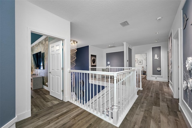 19620 Eagle Crest Dr, Lutz, FL 33549 - hall featuring an upstairs landing, wood finished floors, baseboards, and a textured ceiling